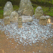 Kinkakuji-StatuesWithCoins.gif